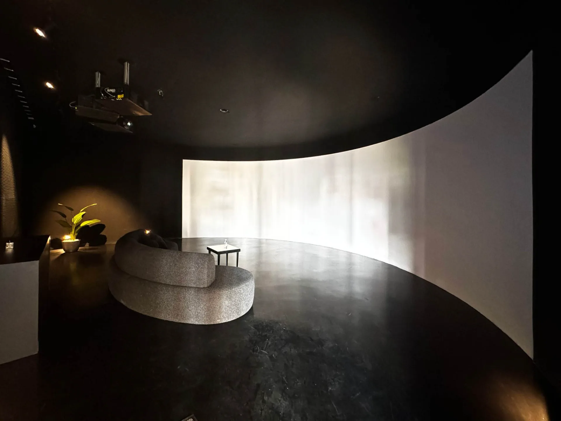 The immersive room with its curved projection screen